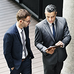 Business men with tablet.