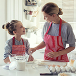 mother daughter cooking.